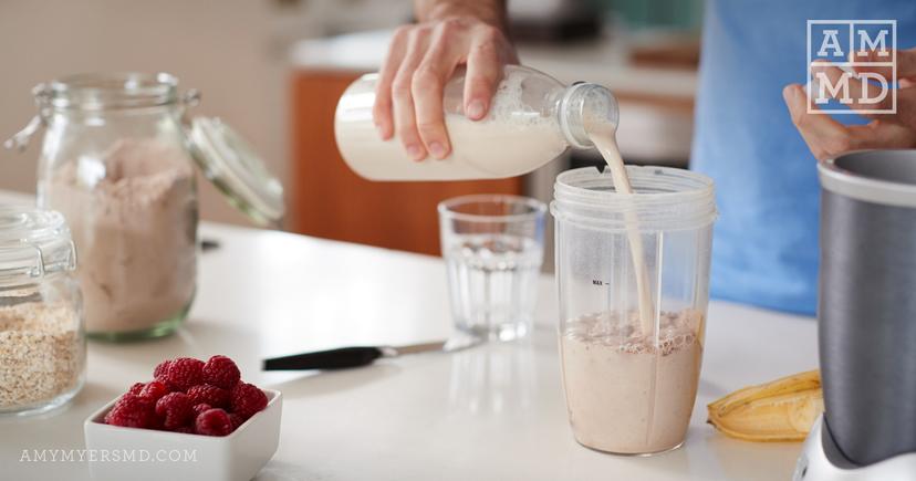 Man pouring milk - Your Protein Guide - Amy Myers MD®