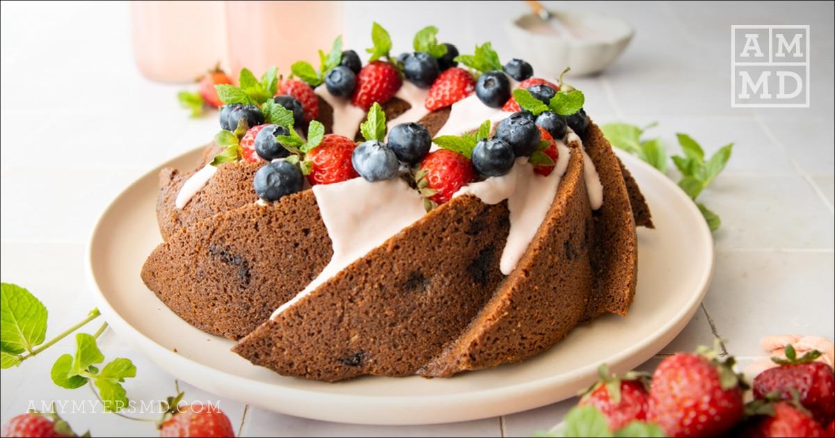 Bundt Cake with icing and berries - Almond Berry Bundt Cake - Amy Myers MD®