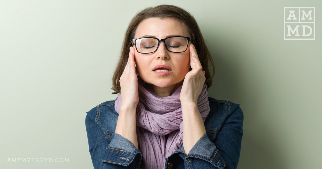 Stressed Woman Massaging Temples - Why Am I So Irritable and Moody?! - Amy Myers MD®