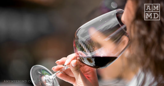 Sipping a glass of red wine - Candida and Alcohol: The Perfect Storm - Amy Myers MD®