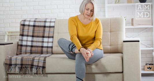 Woman rubbing sore feet - Do You Have a Glutathione Deficiency? - Amy Myers MD®