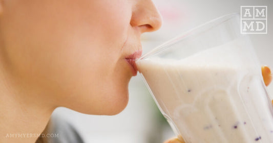 Person sipping smoothies - a Semi-Elemental Diet or Elemental Diet: What's Best for SIBO - Amy Myers MD®